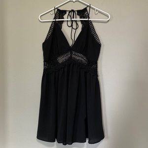 Open back, black babydoll dress.